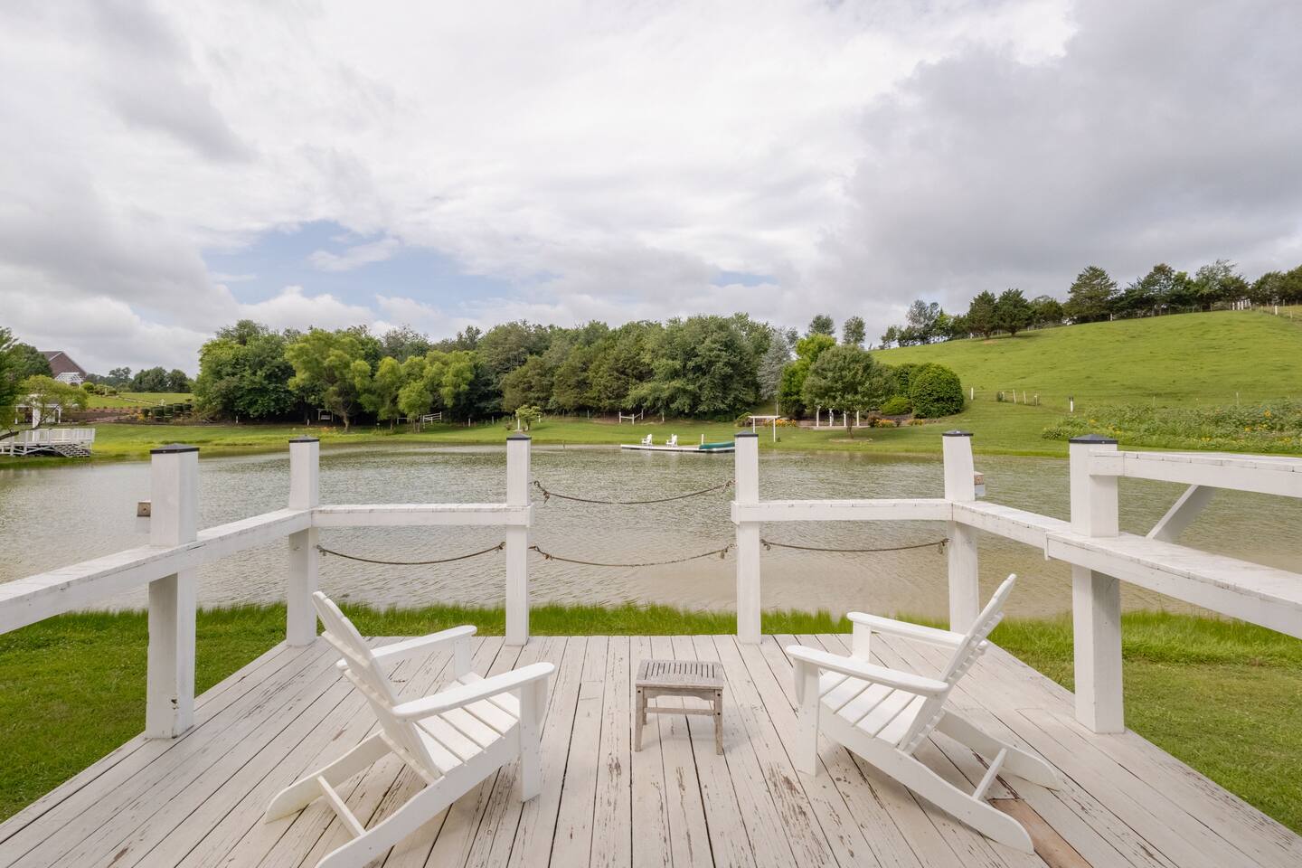 FishHouse Tiny Home at Cedar Pond Farms in New Market — a lakeside tiny home on a working farm with Scottish Highland cattle.
